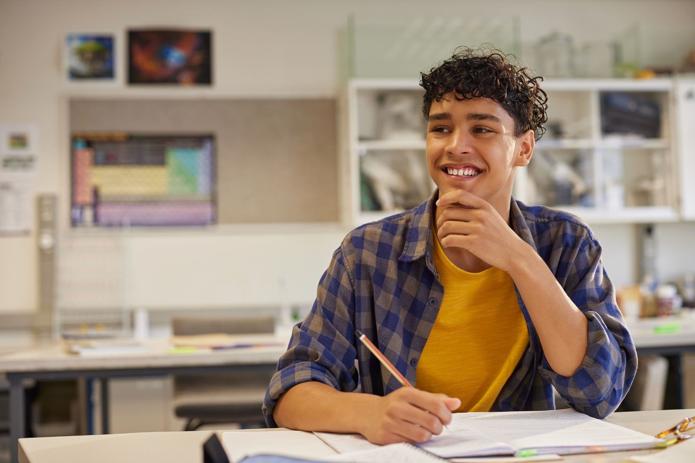 An international student smiling on campus